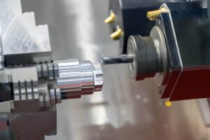 A multi-tasking CNC lathe machine mills metal shaft parts using a milling turret