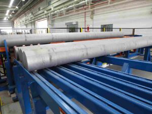 Cylindrical aluminum rods in a factory setting