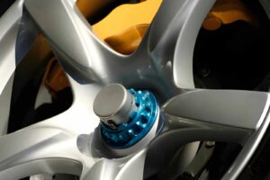 Aluminum race wheel rim with blue anodized component