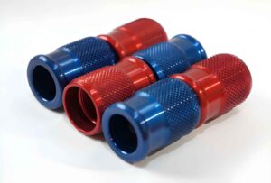 Close-Up of Red and Blue CNC Aluminum Fittings parts
