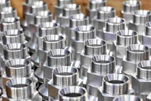 Mass-produced stainless steel threaded components